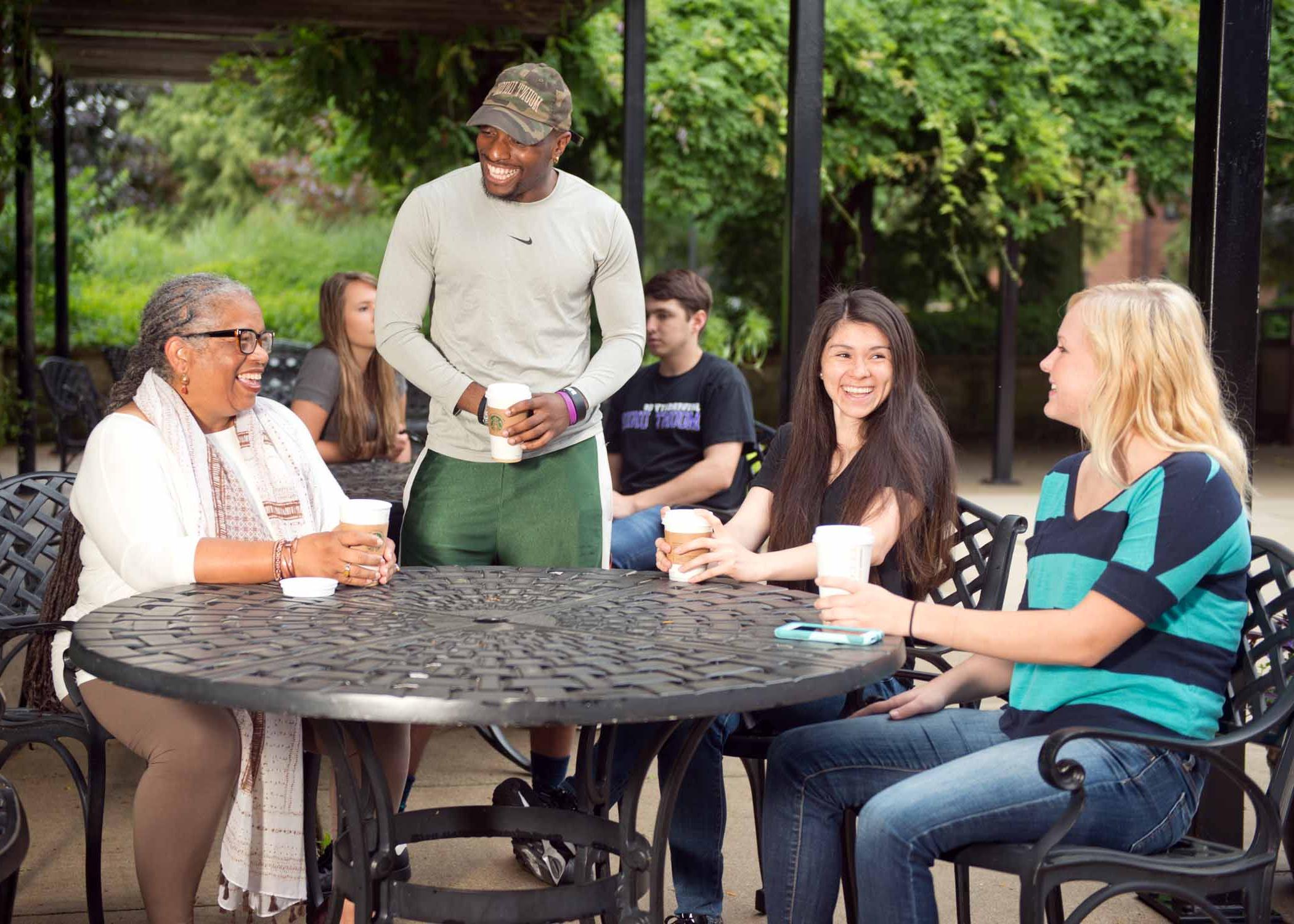 University of Mount Union students and professor on patio